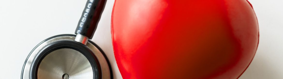 Closeup of heart and a stethoscope cardiovascular checkup concept