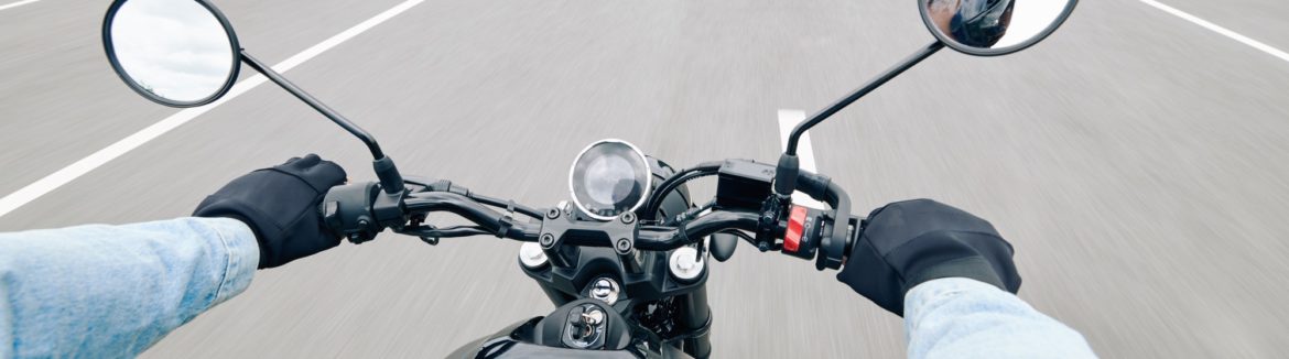 Handlebar of motorcycle while on the highway.